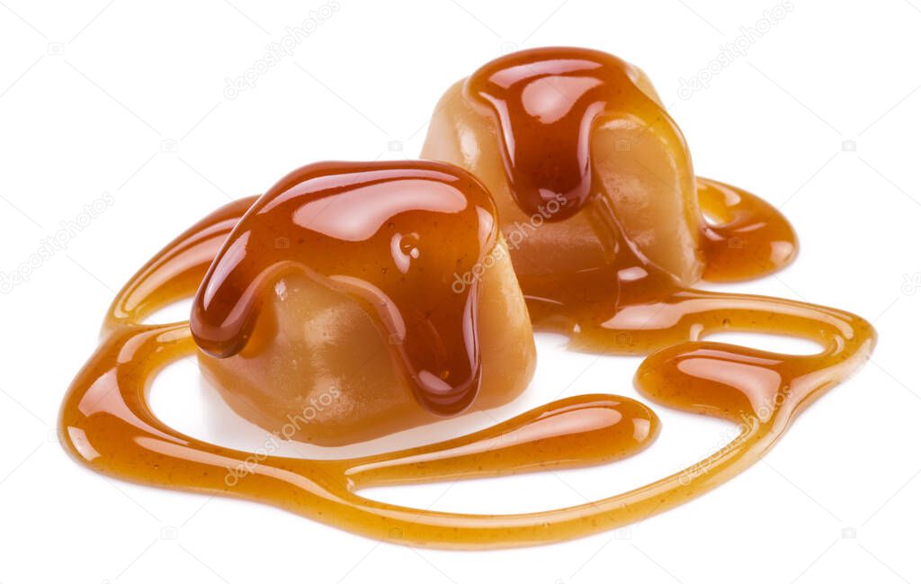 Caramel candies covered with melted sugar caramel isolated on white background.