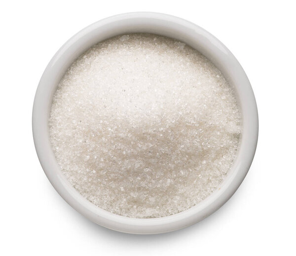White refined sugar in ceramic bowl on white background. Top view. File contains clipping path. 