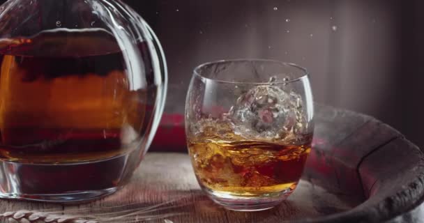 Ice Cube Slowly Falls Glass Whiskey Top Vintage Whiskey Barrel — Stock Video