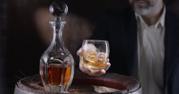 Man Suit Beard Sommelier Takes Glass Whiskey Ice Vintage Whiskey — Stock Video