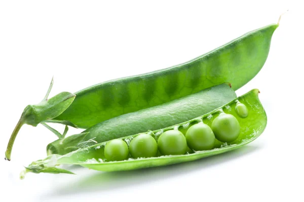 Fresh peas are contained within a pod. — Stock Photo, Image