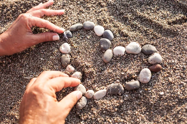 Heart symbol is made of marine shingles. — Stock Photo, Image