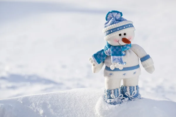 Little snowman with carrot nose in the snow. — Stock Photo, Image