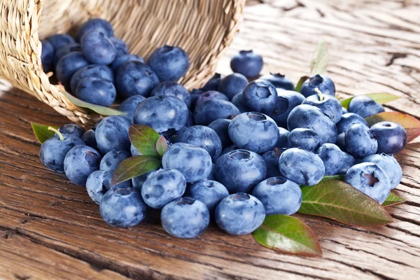 Blueberries over old wooden table. — Stock Photo, Image