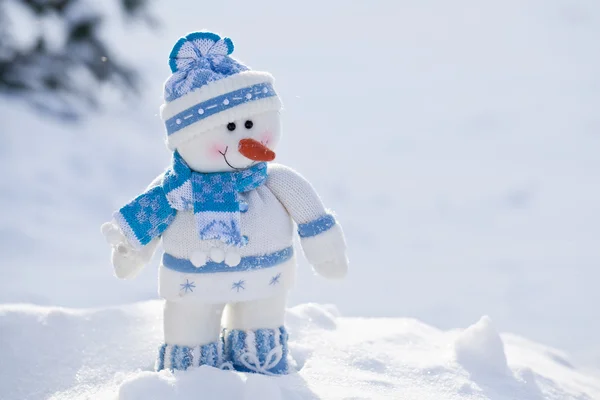 Little snowman with carrot nose in the snow. — Stock Photo, Image