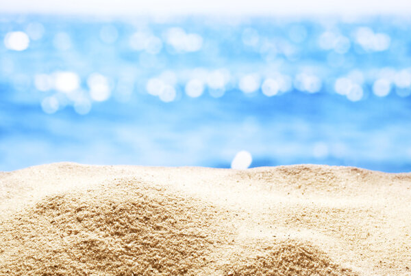 Sand with blurred sea background.