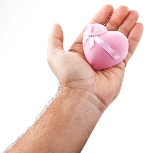 Růžové srdce v mužských rukou. — Stock fotografie