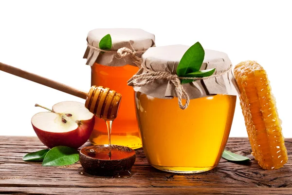 Glass cans full of honey, apples and honeycombs wood. File conta — Stock Photo, Image