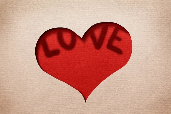 心里面的剪影在纸张的两个字"爱". — 图库照片
