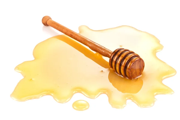 Wooden stick in the honey stain. — Stock Photo, Image