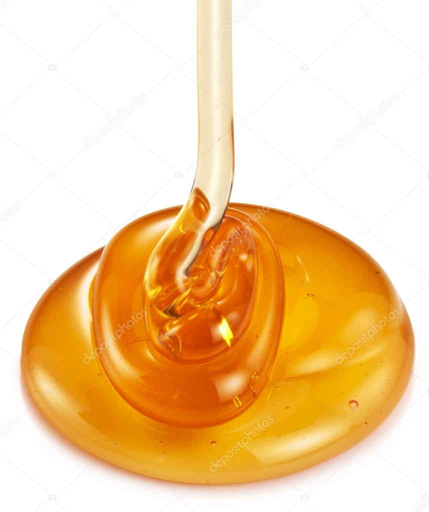 Honey flowing from wooden stick.