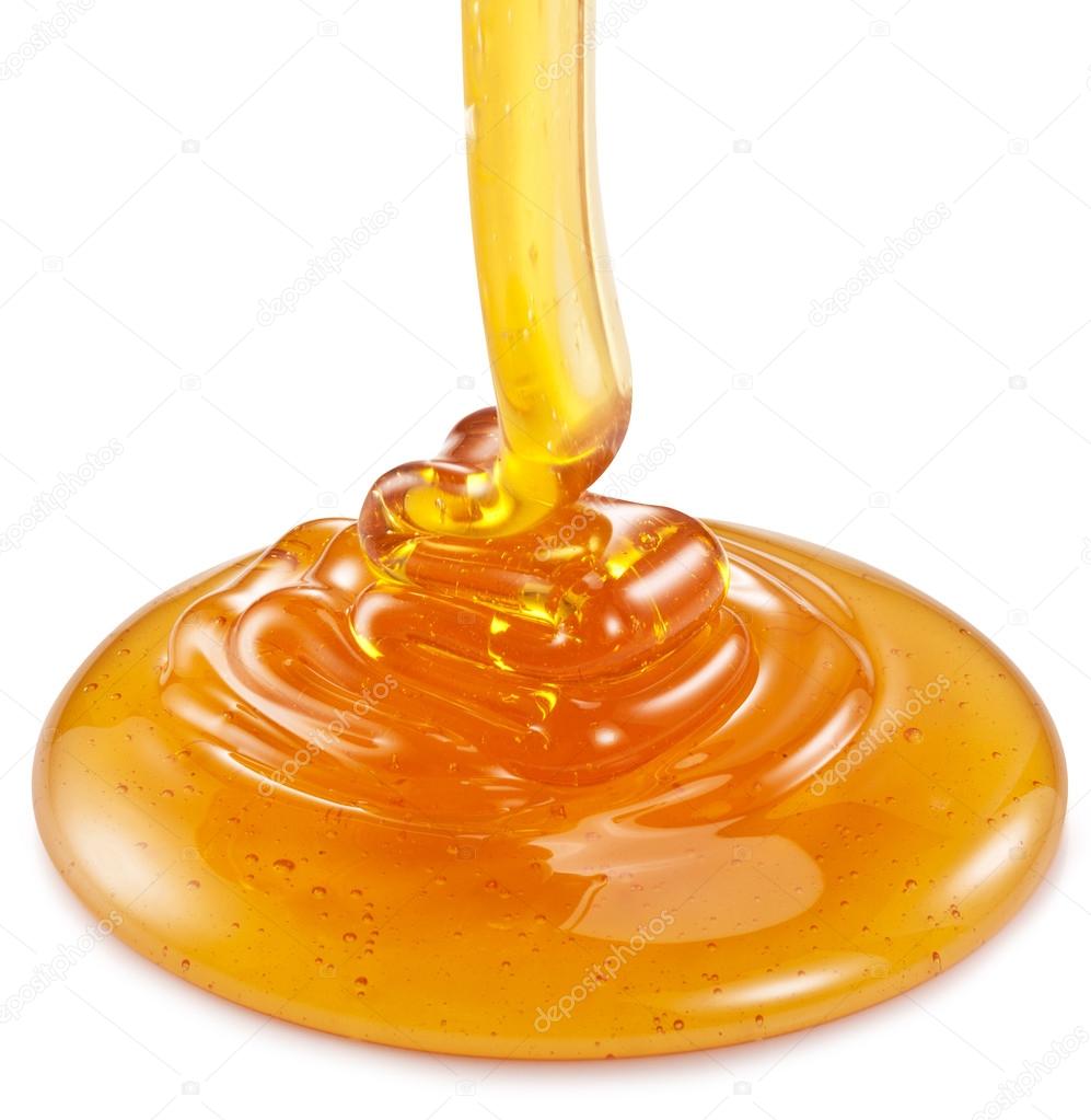 Honey flowing on the white background.