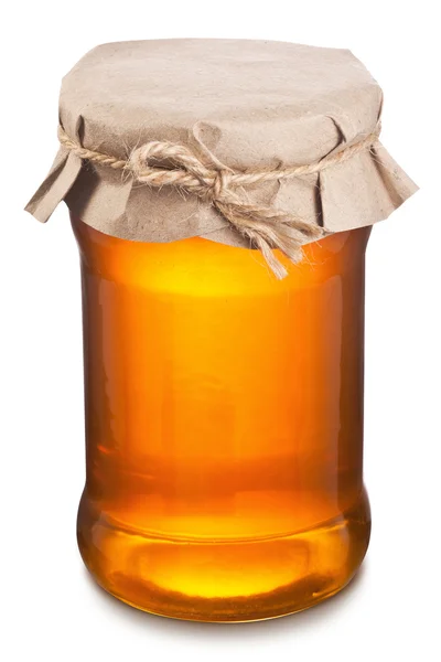Lata de vidro cheio de mel . — Fotografia de Stock