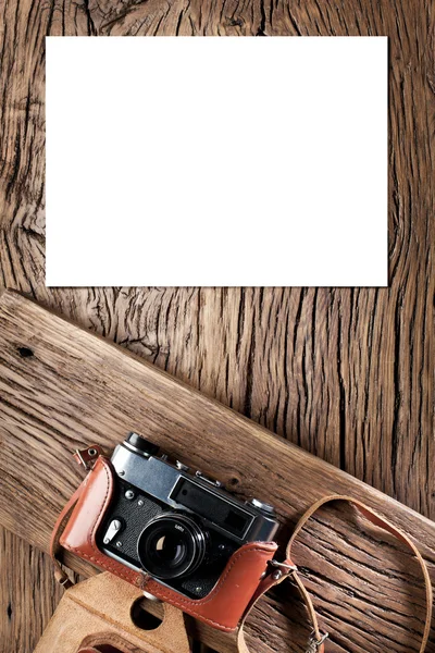 Old rangefinder camera on the old wooden table. — Stock Photo, Image