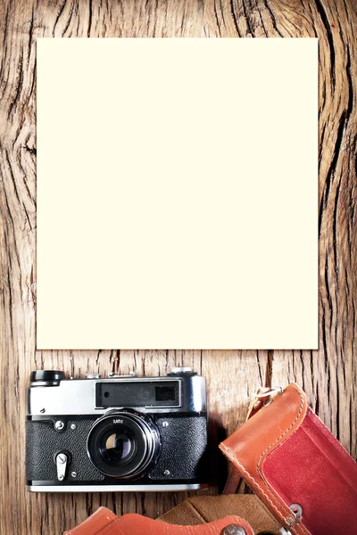 Old rangefinder camera on the old wooden table. — Stock Photo, Image