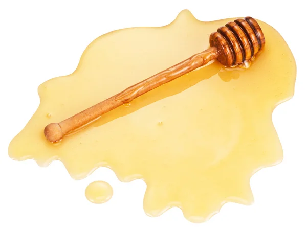 Wooden stick in the honey stain. — Stock Photo, Image
