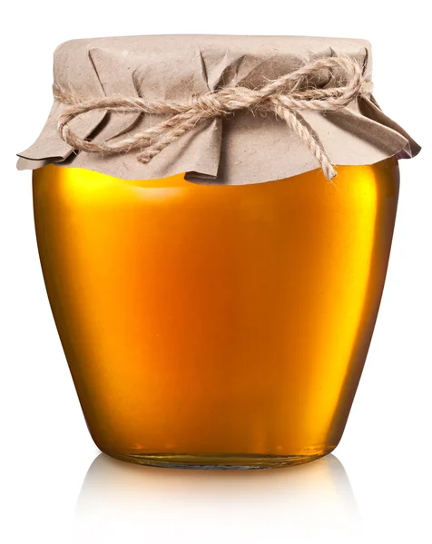 Lata de vidro cheio de mel . — Fotografia de Stock