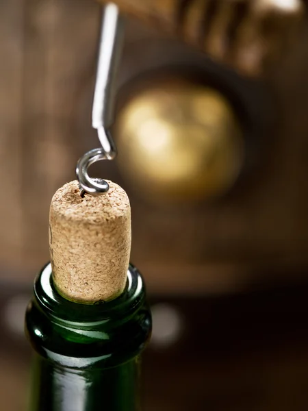 Opening of a wine bottle with corkscrew. — Stock Photo, Image