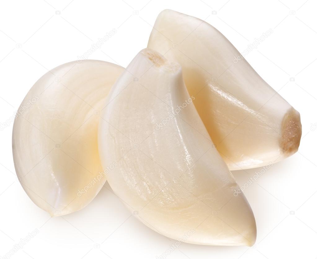 Peeled garlic cloves isolated on a white background.