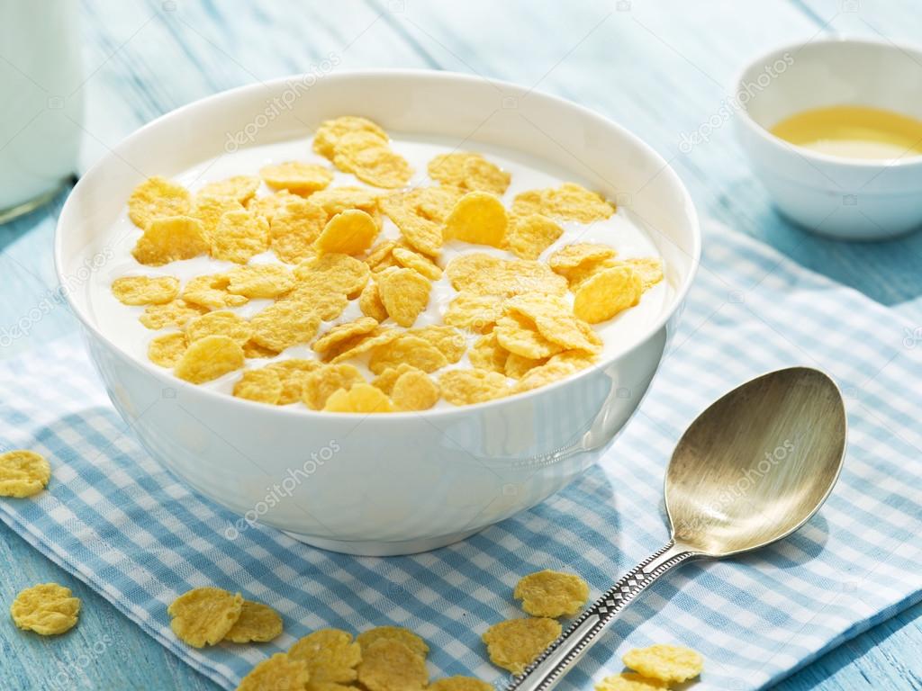 Cornflakes cereal and milk.