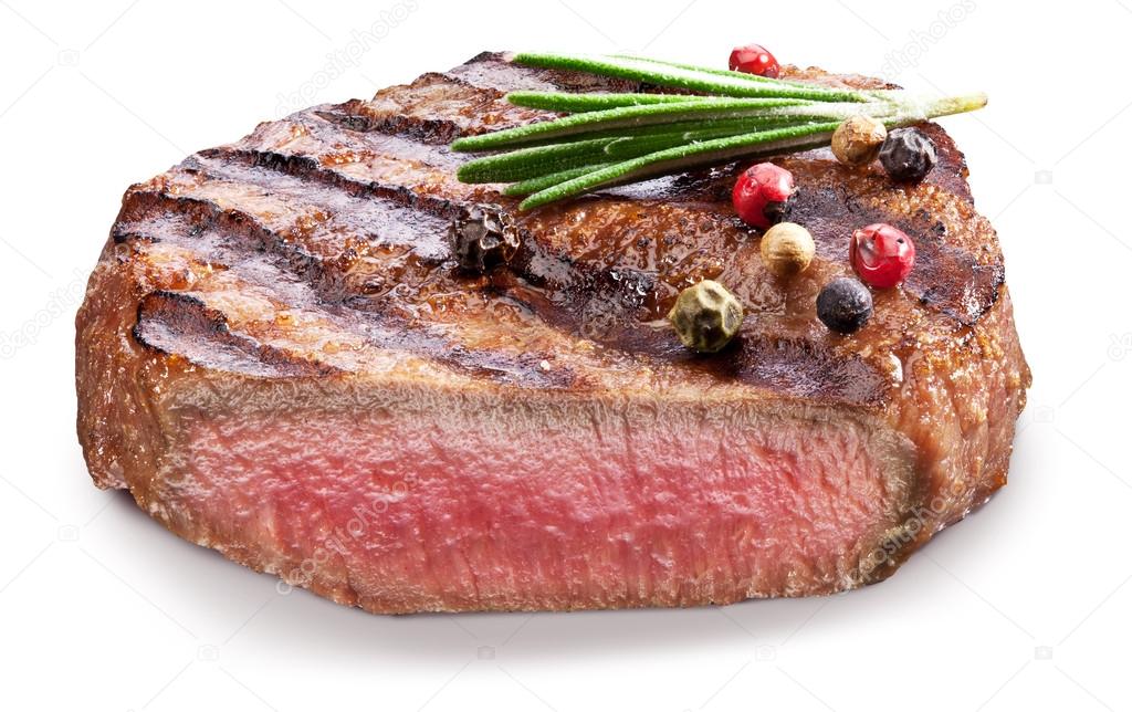 Beef steak with spices on a white background.