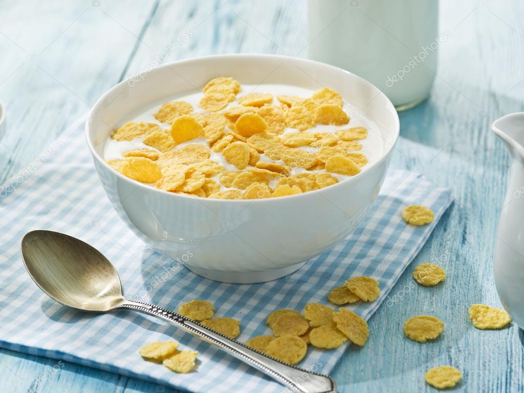 Cornflakes cereal and milk. 