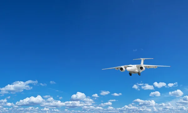 Airplane in the blue sky. — Stock Photo, Image