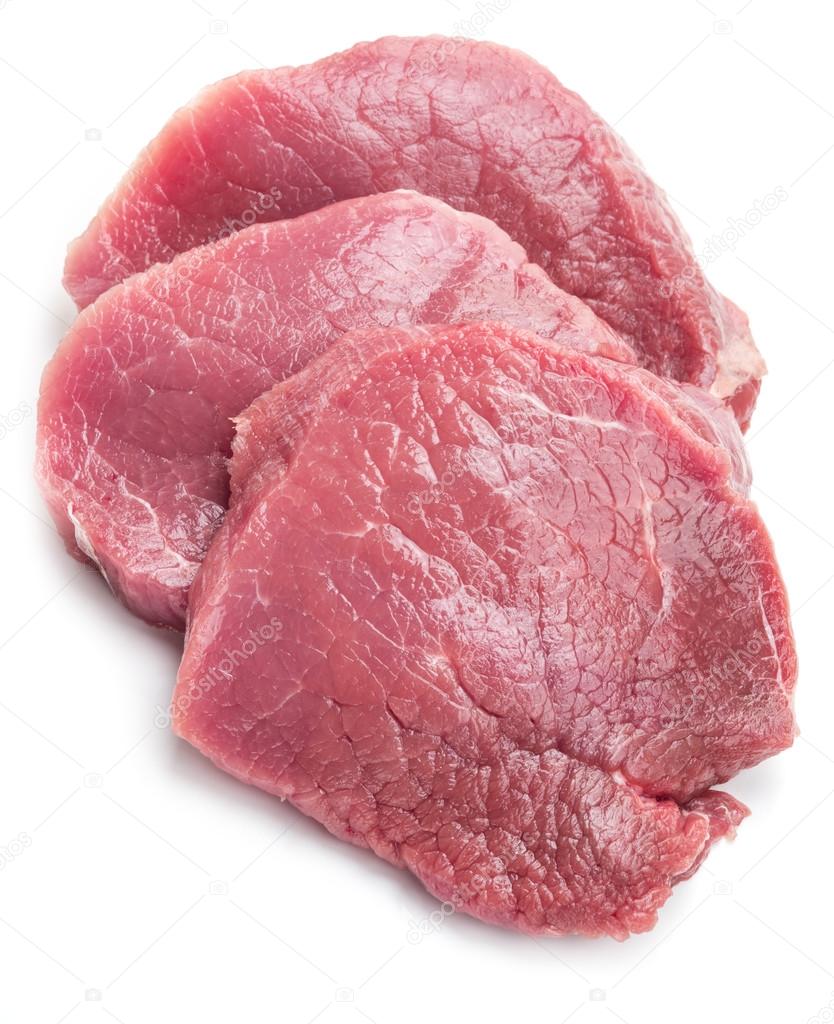 Raw beaf steaks on a white background.