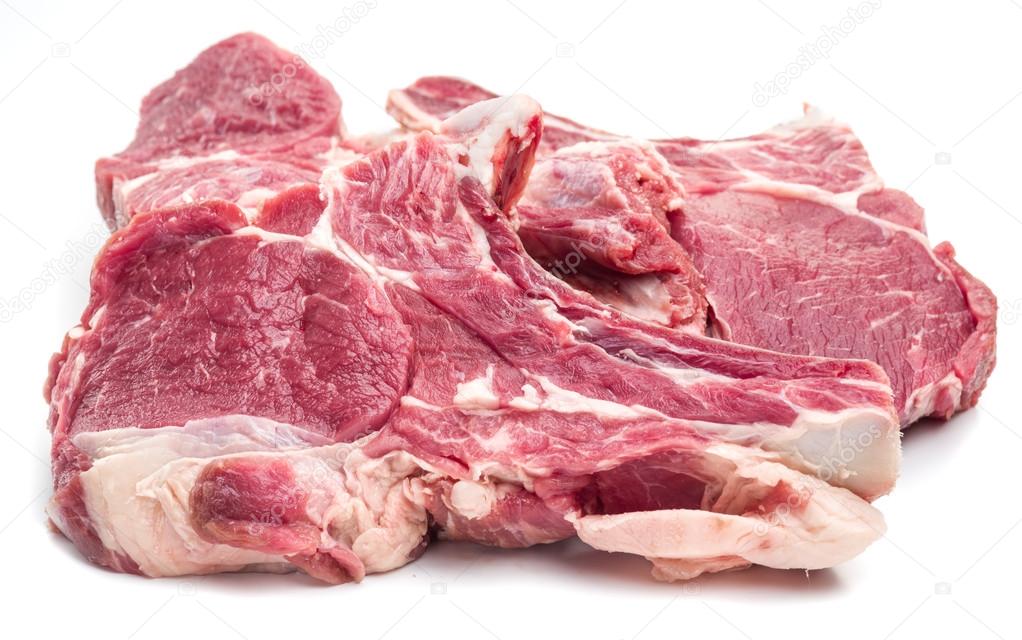 Raw beaf steaks on a white background.