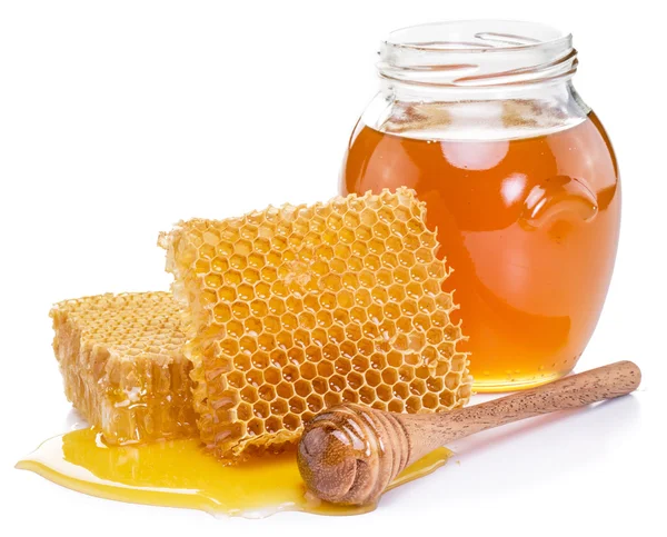 Jar full of fresh honey and honeycombs. High-quality picture. Royalty Free Stock Photos