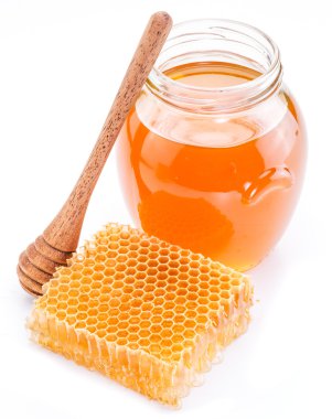 Jar full of fresh honey and honeycombs. High-quality picture. clipart
