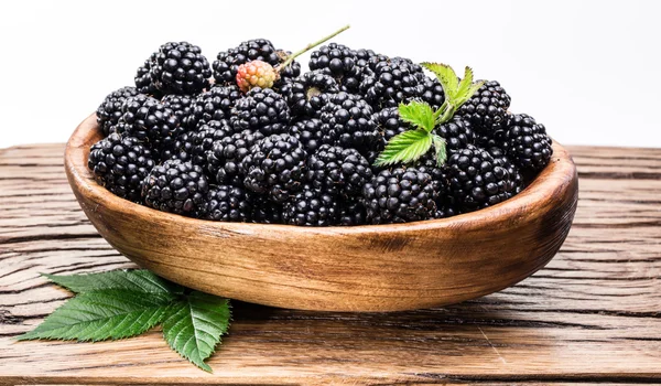 Blackberries in the wooden bowl. White background. — Stock Photo, Image