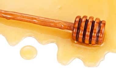Wooden stick in the honey stain. clipart