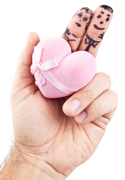 Couple painted on man's fingers and gift box in the form of hear — Stock Photo, Image