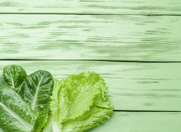 Salad on the green wooden background. — Stock Photo, Image