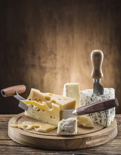 Variety of cheeses. Vintage stiles. — Stock Photo, Image