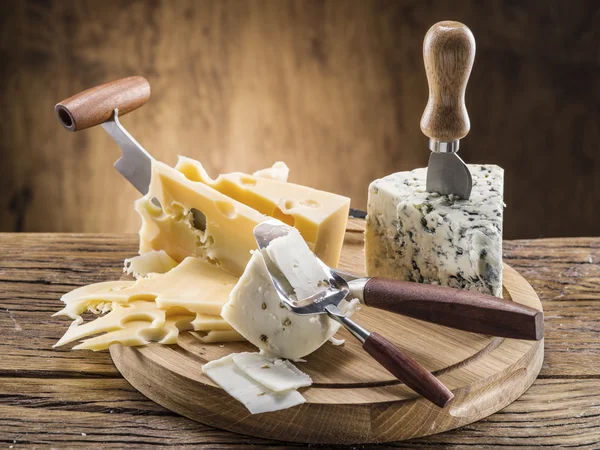 Variety of cheeses. Vintage stiles. — Stock Photo, Image