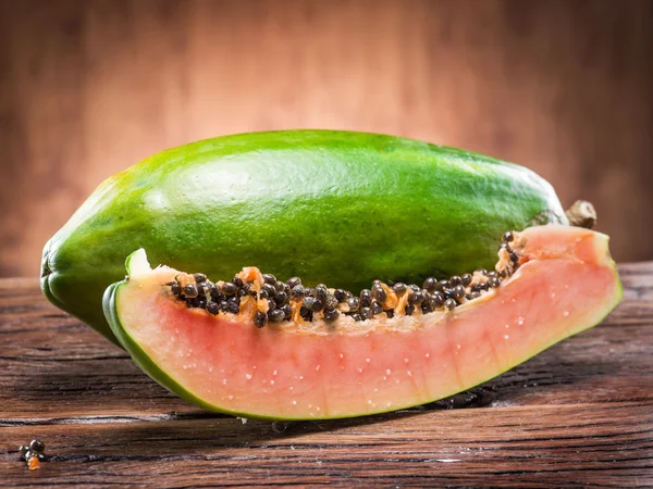 Papaya fruit on wooden background. — Stock Photo, Image