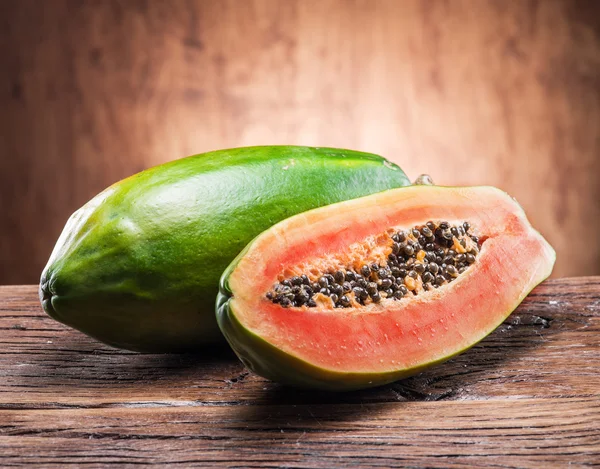 Papaya fruit on wooden background. — Stock Photo, Image