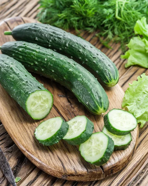 Cucumbers on the wooden table. — Stock Photo, Image