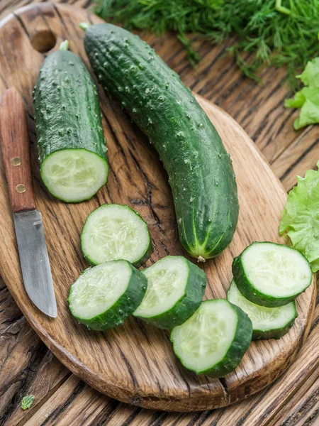 Cucumbers on the wooden table. — Stock Photo, Image