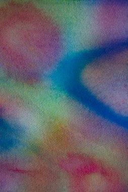 Kağıt arkaplanda farklı renk ve dokulara sahip güzel bir suluboya resim.