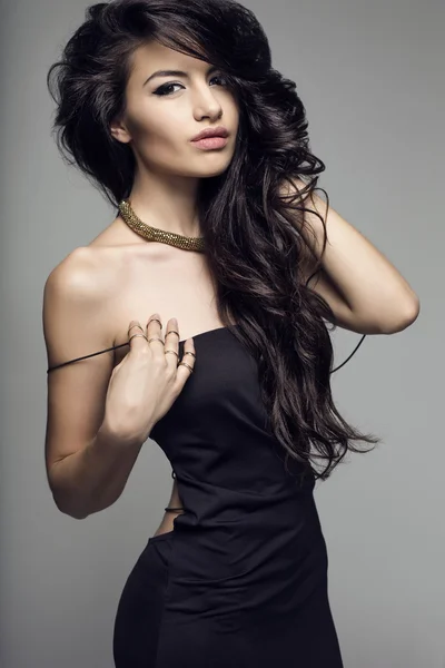 Woman posing in black dress — Stock Photo, Image