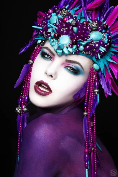 Woman with colorful make up in carnival headwear — Stock Photo, Image