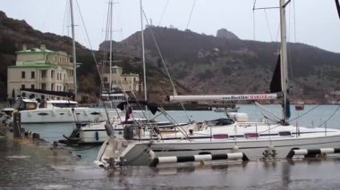 Sevastopol, Balaklava Bay, Crimea, Russia-March 26, 2021:Boats and Yachts near the pier in the bay of Balaclava, Crimea
