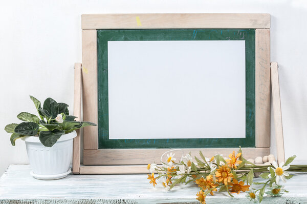 Frame for a picture on a wooden table