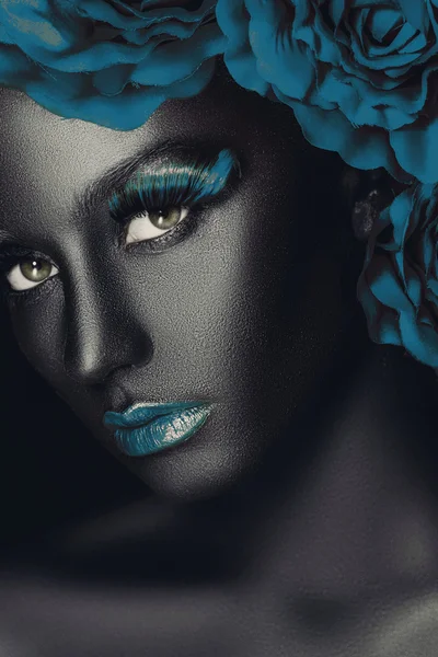 Creative and fashion portrait of a dark-skinned girl with color make-up — Stock Photo, Image