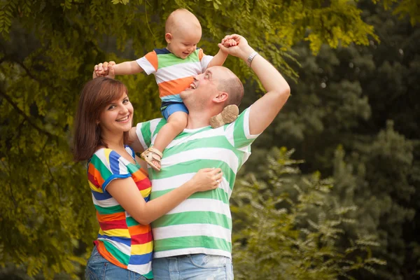 Happy family having fun outdoors on a summer day — Stock Photo, Image