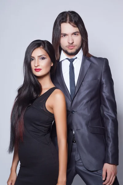 Fashion style photo of beautiful couple, studio shoot — Stock Photo, Image