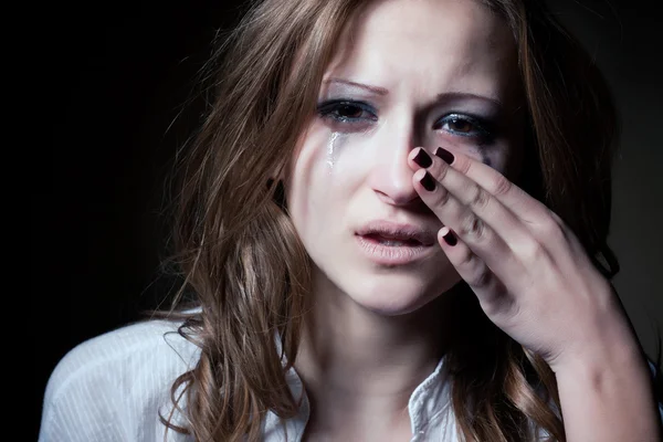 Crying young girl isolated